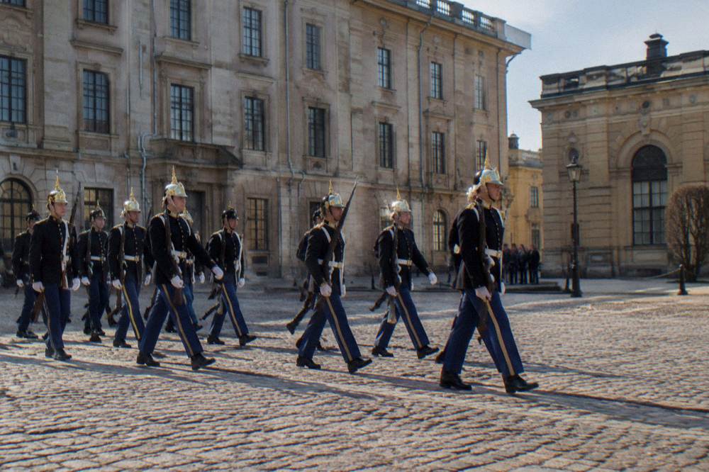 The Royal Guard marching across the Outer Courtyard of Stockholm's Royal Palace in uniform